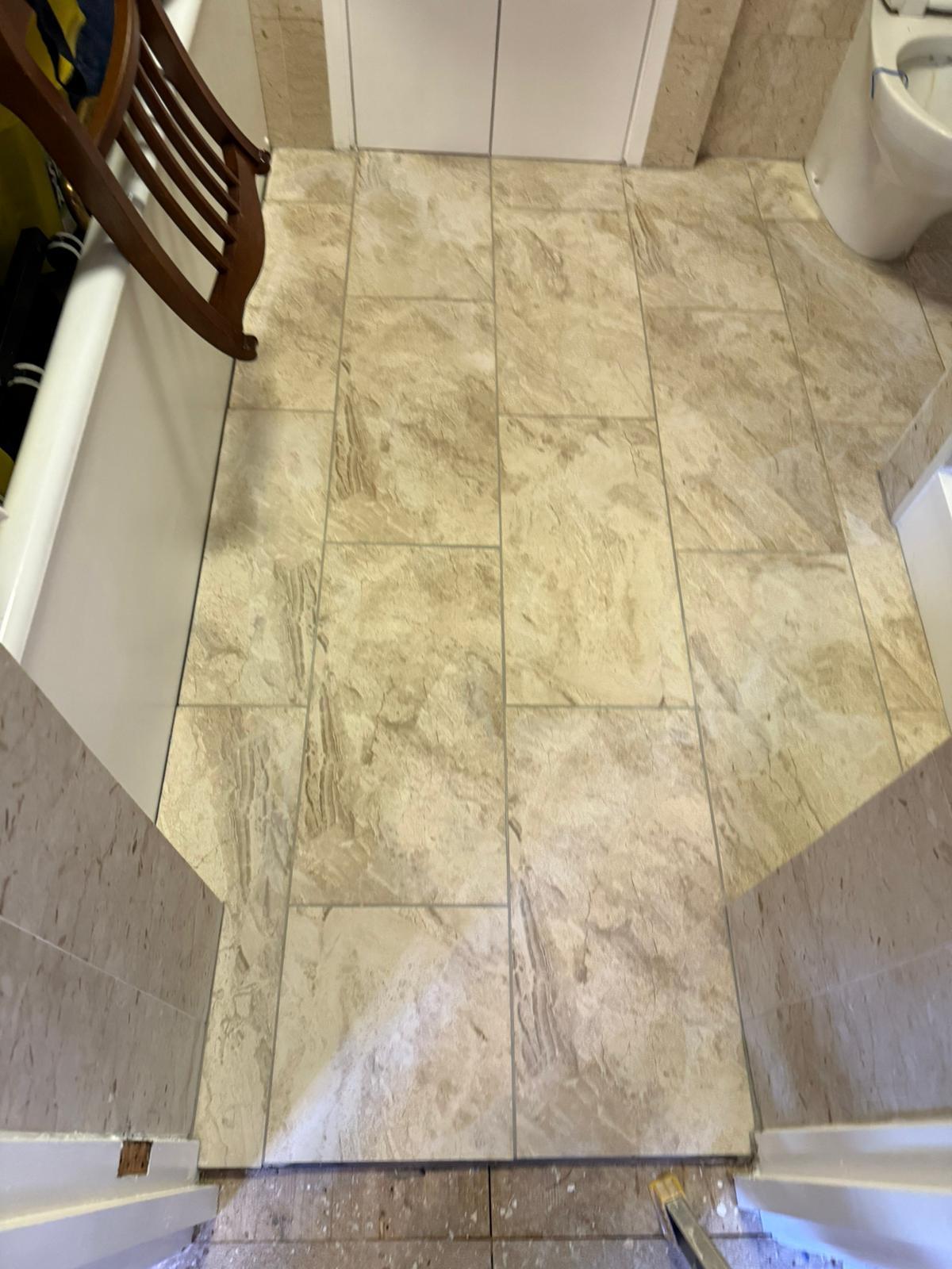 Completed tiled bathroom floor viewed from the doorway
