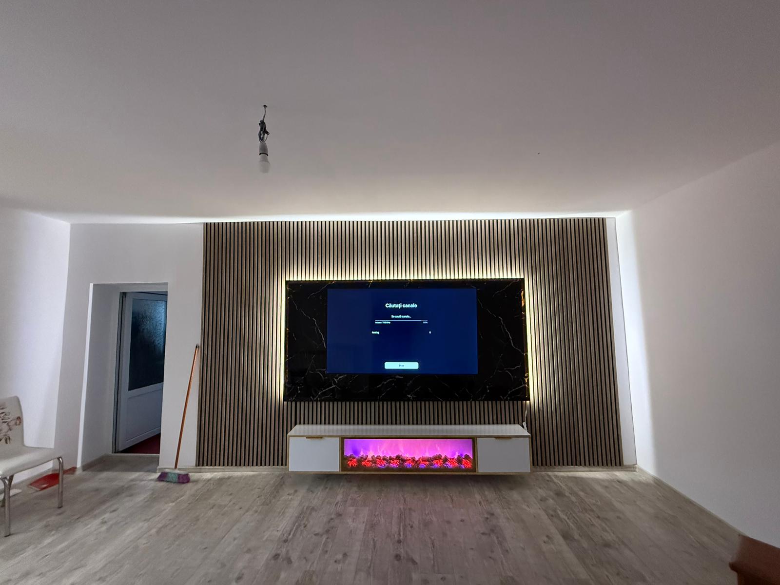 Bespoke media wall with slatted panels, TV and LED lighting